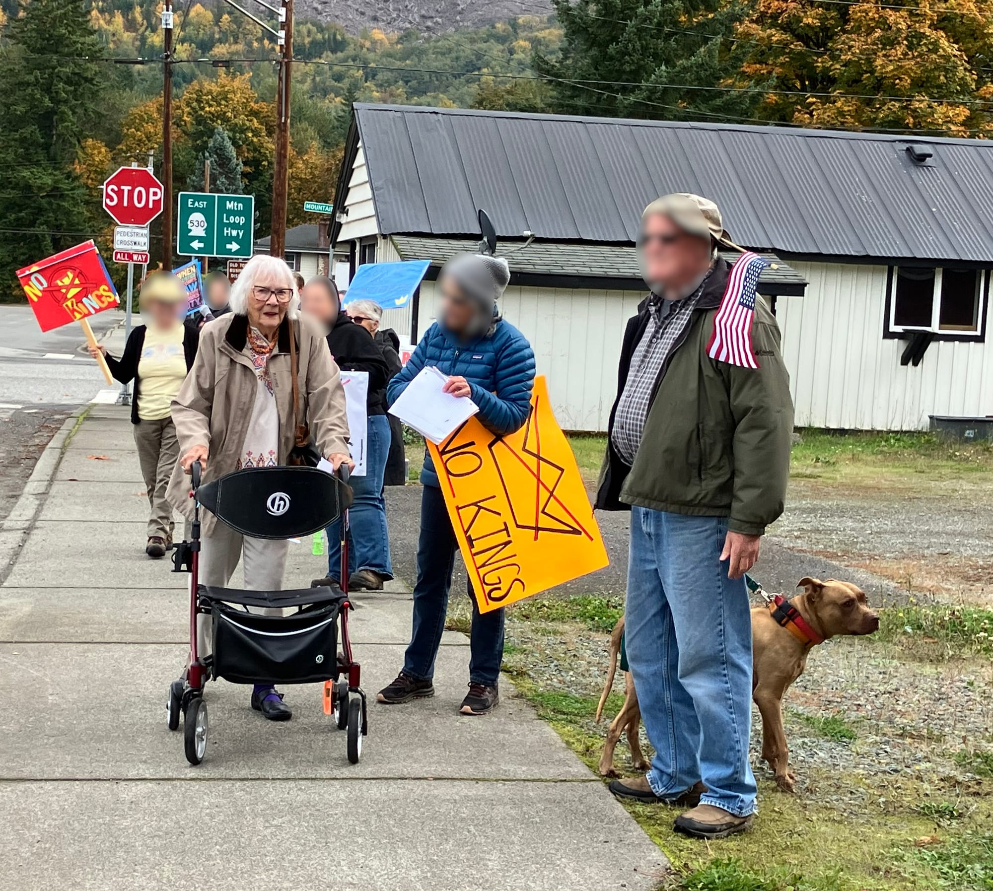 Darrington, WA No Kings rally Oc 18, 2025. Elderly woman with walker engages with group.