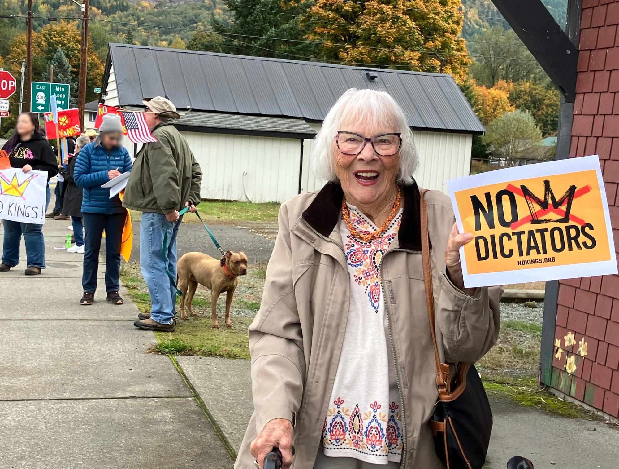 Katy, age 92, wanted to be sure her picture was taken with a No Kings sign.